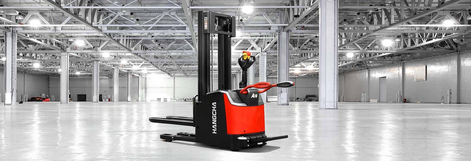 A series high range stand-on pallet stacker with initial lift